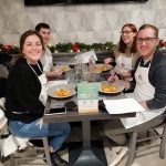 Smiling while tasting italian pasta