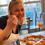Tasting italian pizza with spritz